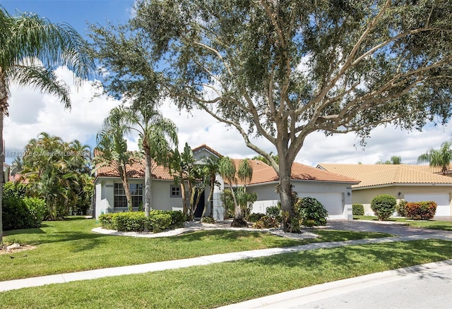 view of front of home featuring a garage and a front lawn