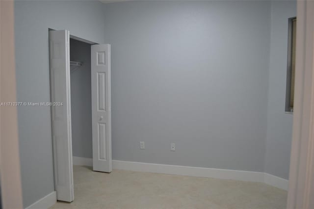 unfurnished bedroom with a closet