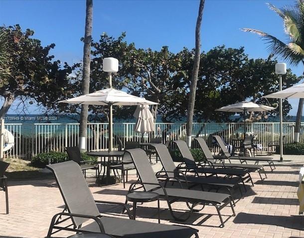 view of patio with a water view