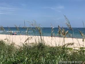 property view of water featuring a view of the beach