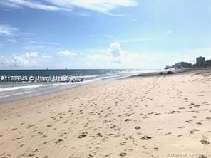 property view of water featuring a beach view