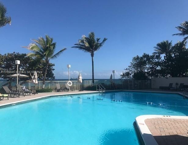 view of swimming pool with a patio area