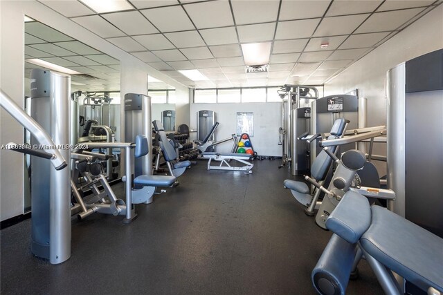 gym featuring a drop ceiling