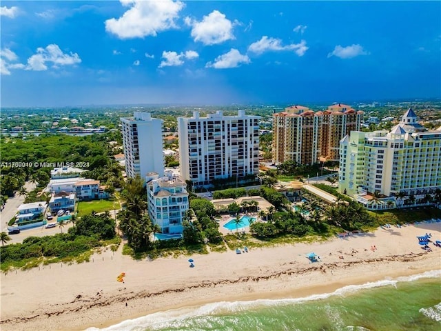 drone / aerial view featuring a view of the beach and a water view