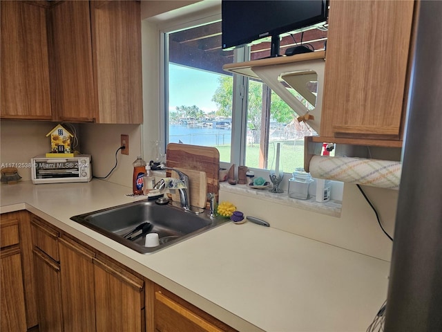 kitchen with sink and a water view