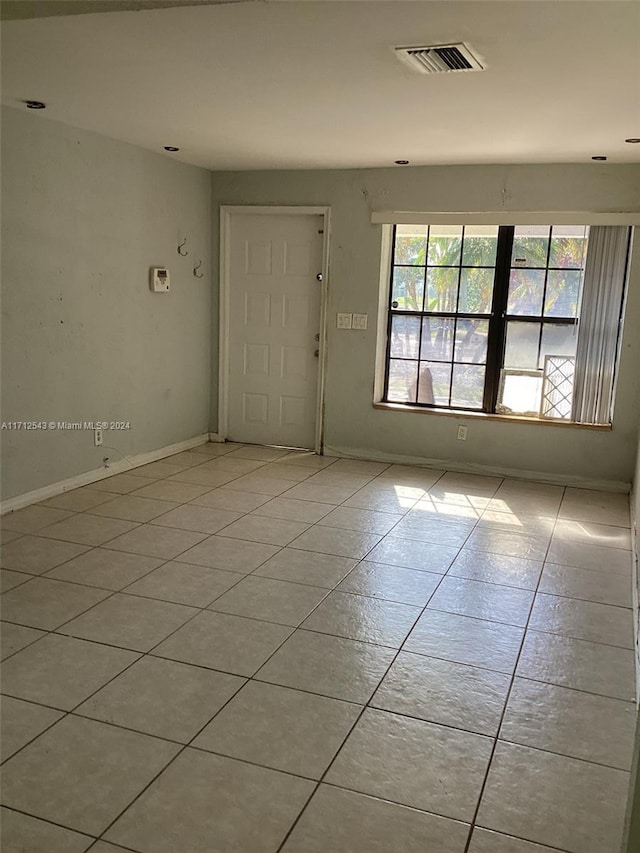 view of tiled spare room