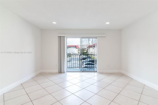 empty room with light tile patterned flooring