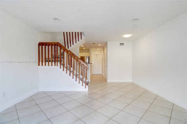 empty room featuring light tile patterned floors