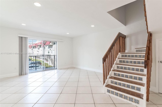 stairs featuring tile patterned floors