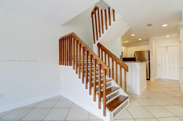 staircase with tile patterned flooring