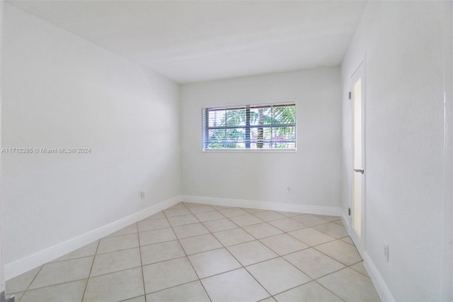 spare room with light tile patterned floors