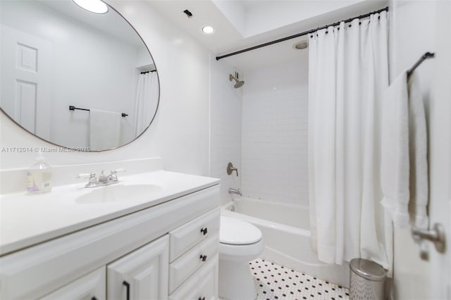 full bathroom with shower / tub combo, vanity, toilet, and tile patterned floors