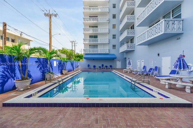 view of swimming pool featuring a patio area