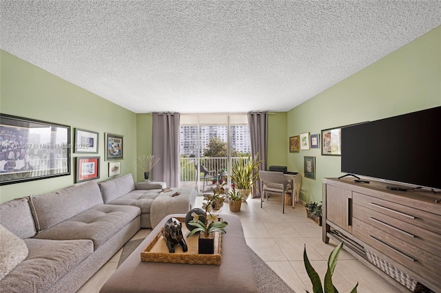 living room featuring light tile patterned flooring and a textured ceiling