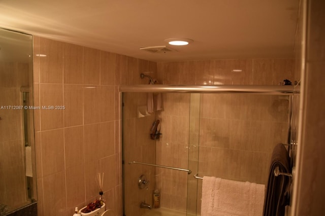 bathroom featuring enclosed tub / shower combo