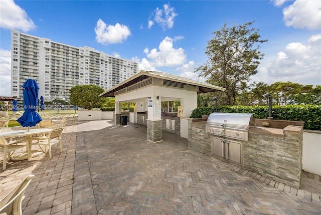 view of patio / terrace with a gazebo, exterior kitchen, and area for grilling