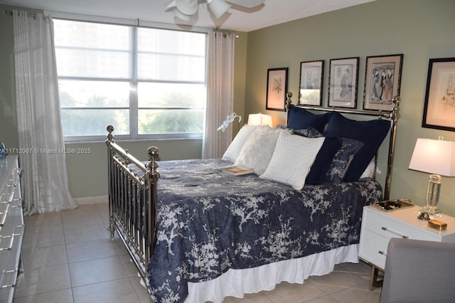 bedroom featuring ceiling fan and light tile patterned floors