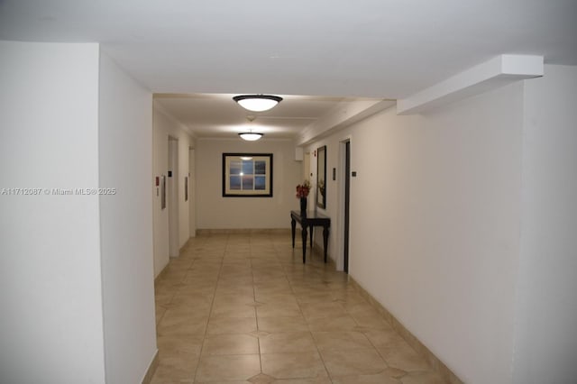 hall featuring light tile patterned flooring