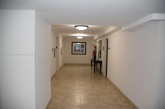 hallway with light tile patterned floors