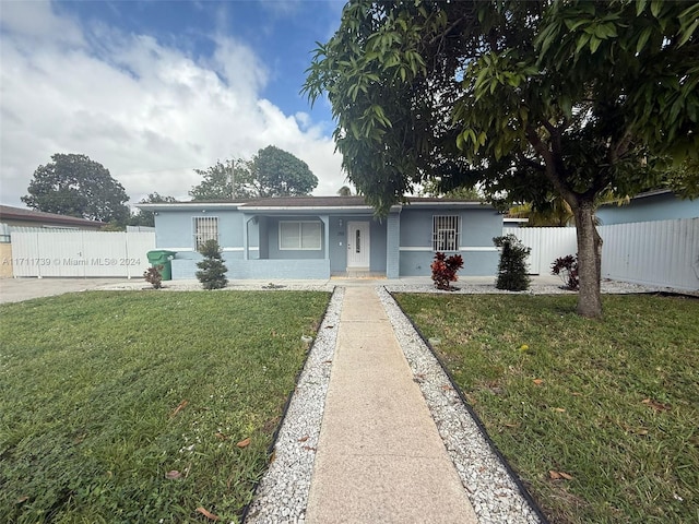 ranch-style house with a front lawn