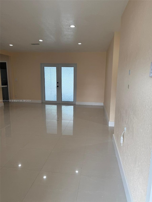 spare room featuring light tile patterned floors