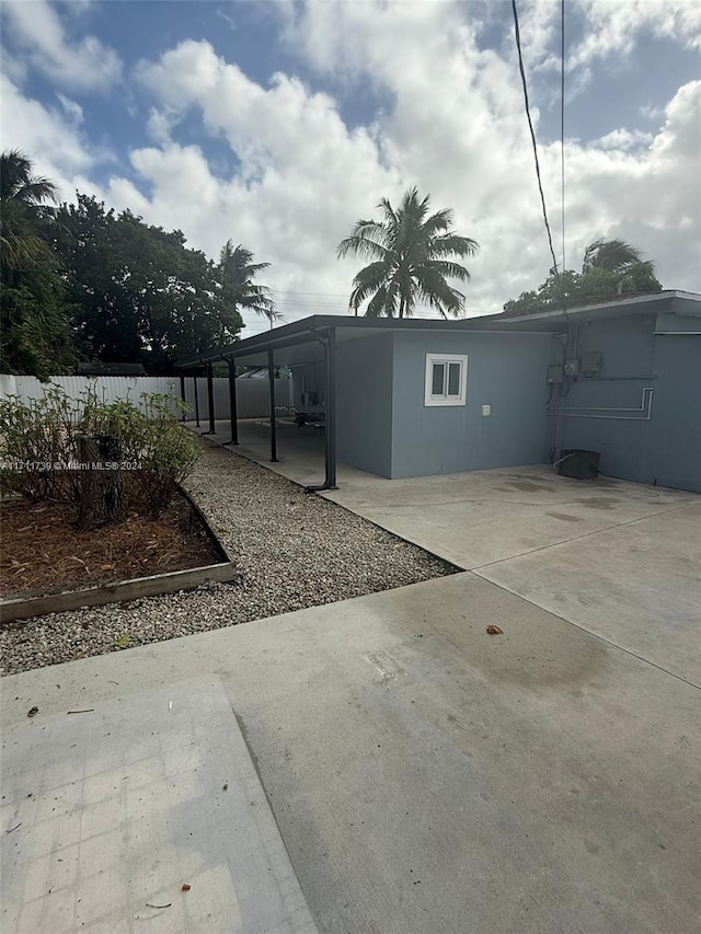 view of side of property featuring a patio area