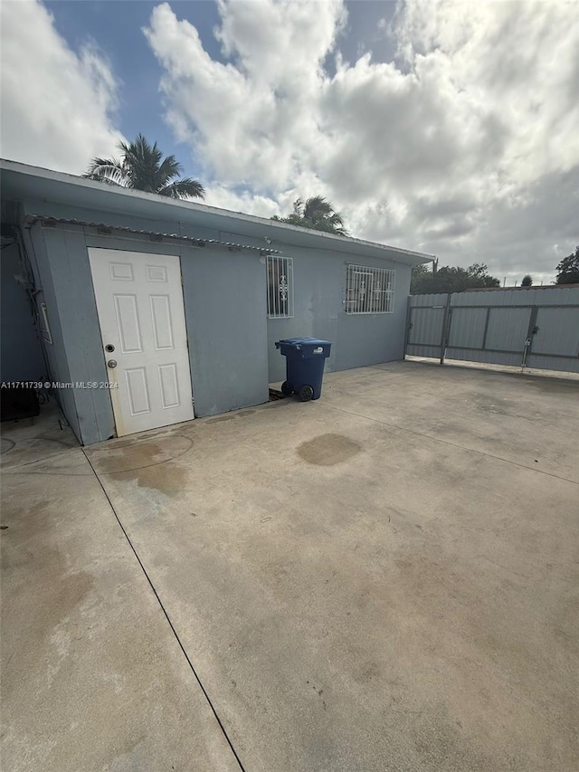 rear view of property featuring a patio