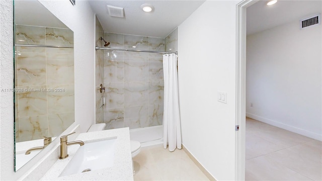 bathroom with a shower with shower curtain, tile patterned flooring, toilet, and vanity