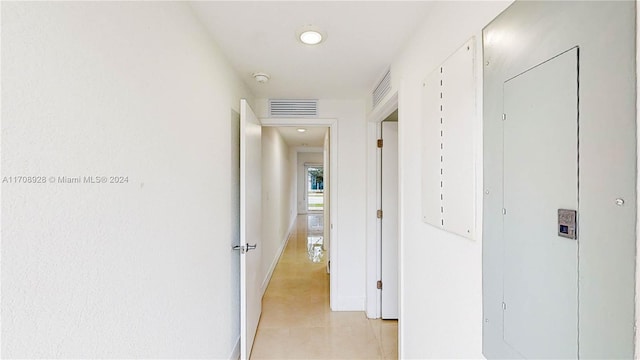 corridor featuring light tile patterned flooring