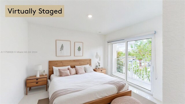 tiled bedroom featuring access to exterior