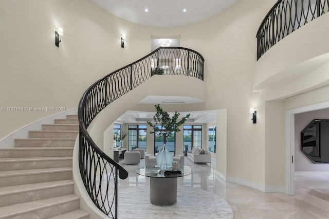 interior space with a high ceiling and french doors