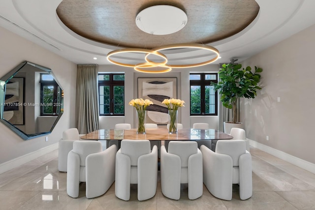 dining area featuring a tray ceiling