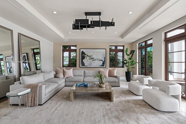 living room featuring a raised ceiling