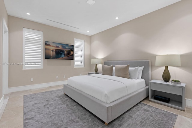 bedroom with light tile patterned floors