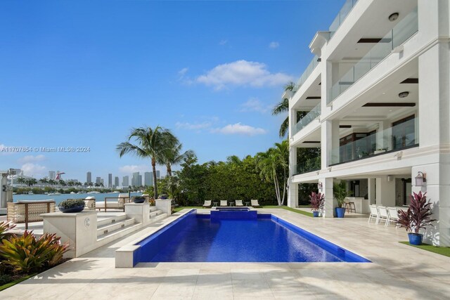 view of pool featuring a patio area