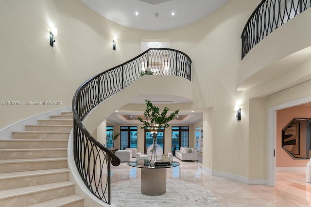 interior space featuring french doors and a towering ceiling