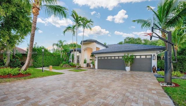 mediterranean / spanish-style home featuring a garage