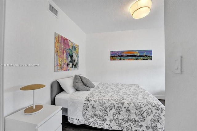 bedroom featuring wood-type flooring