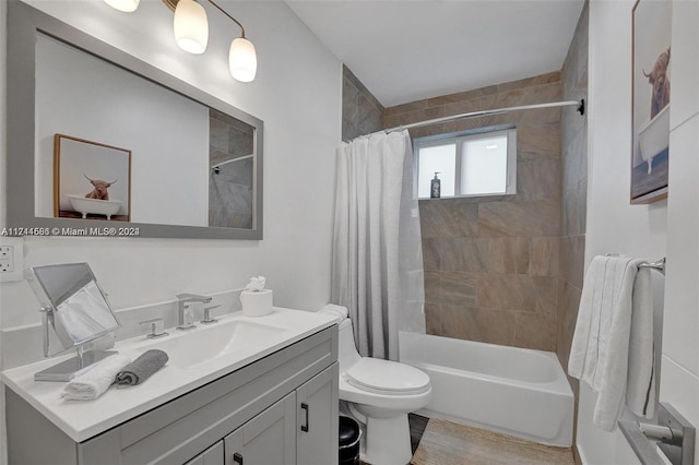 full bathroom featuring shower / tub combo, vanity, and toilet