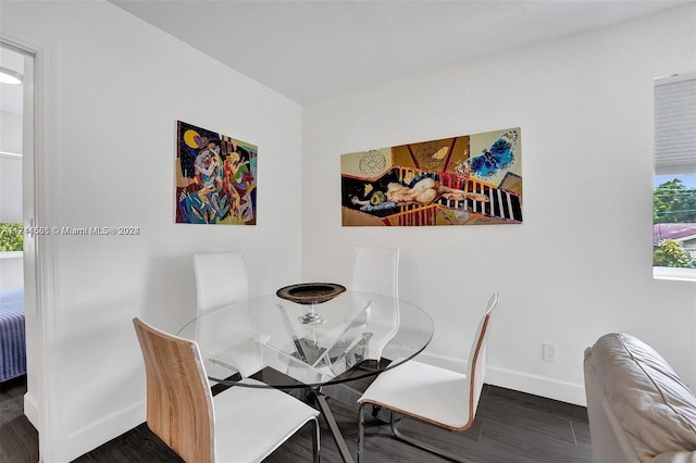 dining area featuring dark hardwood / wood-style flooring