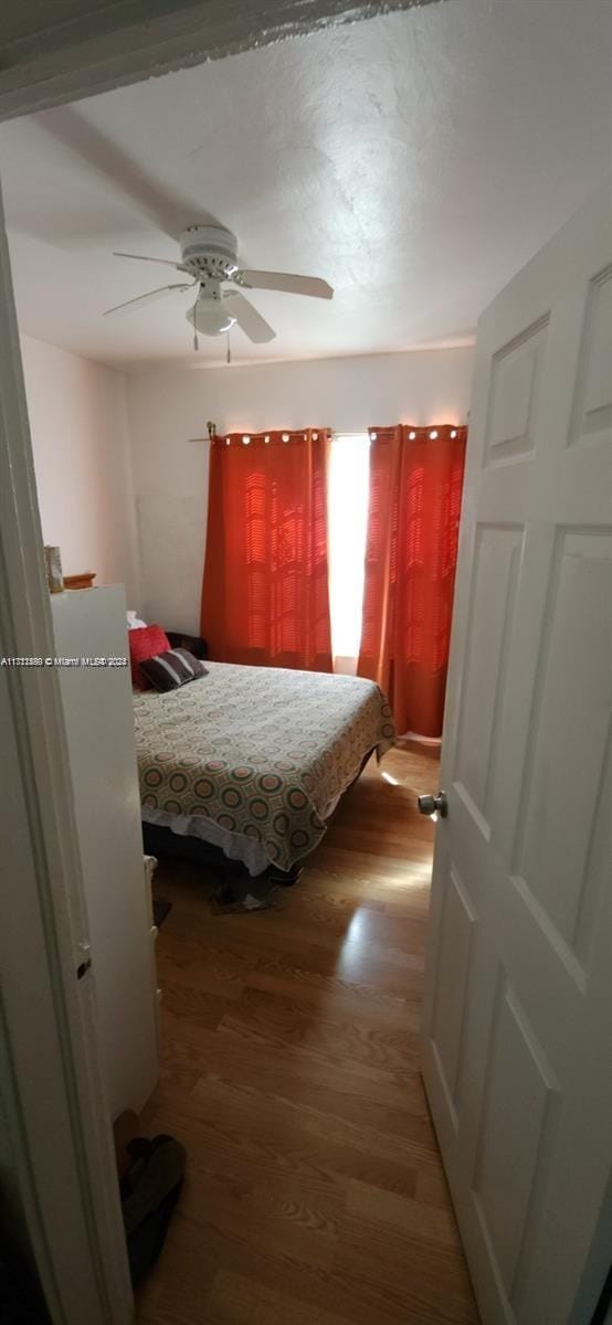 bedroom featuring ceiling fan and light wood-type flooring