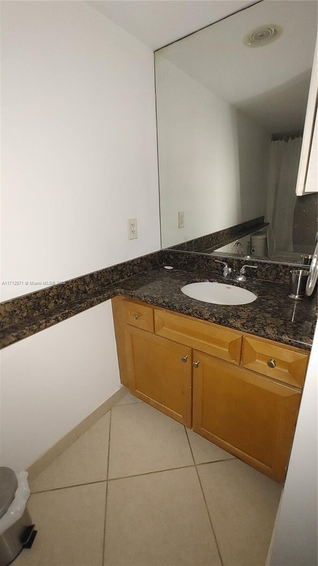 bathroom featuring tile patterned floors and vanity