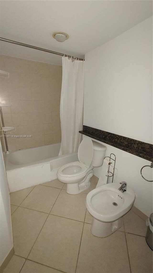 bathroom featuring tile patterned flooring, vanity, and toilet