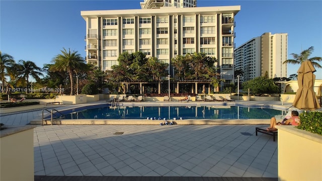 community pool with a patio area