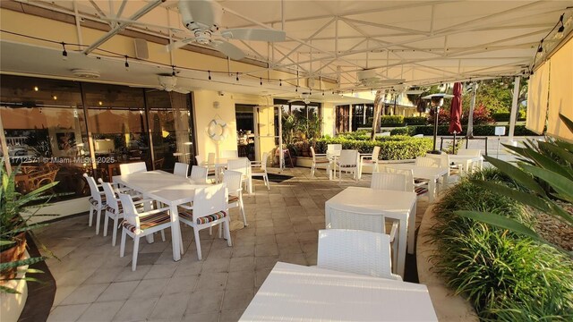 view of patio featuring outdoor dining area and ceiling fan