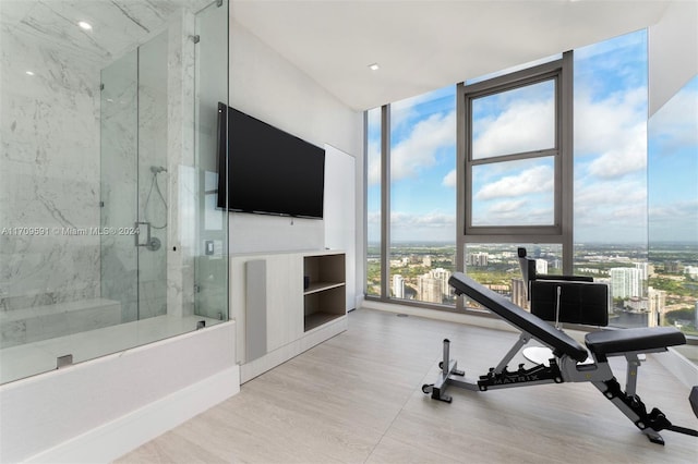 workout area featuring a wall of windows and plenty of natural light