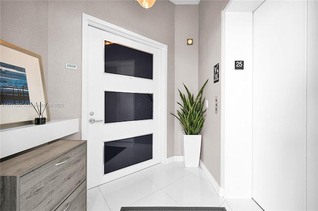 interior space with elevator and tile patterned floors