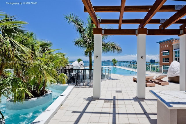 view of swimming pool featuring a pergola and a patio