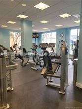 workout area featuring a paneled ceiling