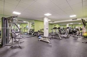 workout area featuring a drop ceiling